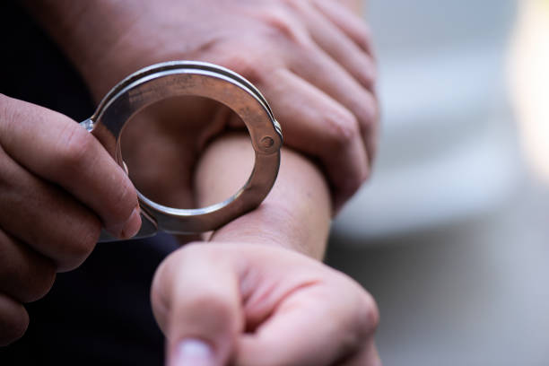 istock Man's hand is locked with the handcuffs 1141441013