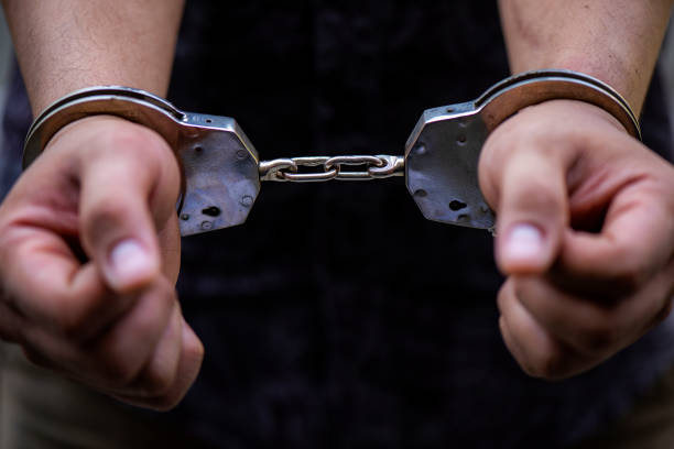 istock Man's hand is locked with the handcuffs 1141441598