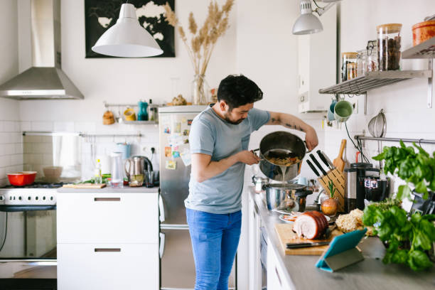 istock Asian man making ramen soup broth 1141441705