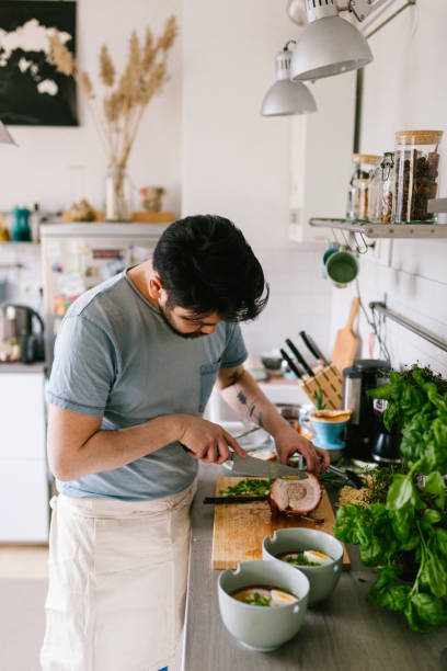 istock Asian man making ramen soup at home 1141441806