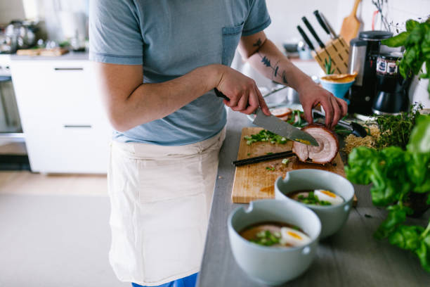 istock Asian man making ramen soup at home 1141441859