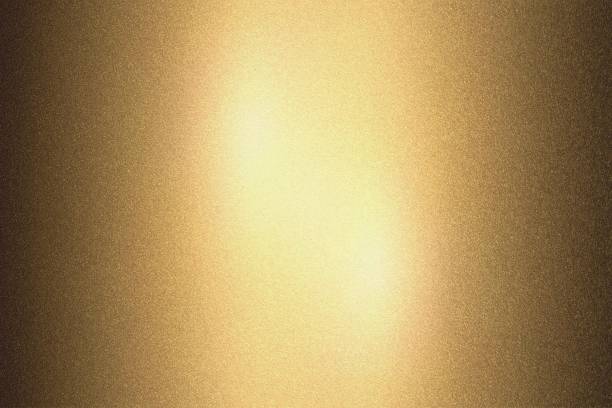 istock Abstract texture background, light shining on golden rough metal 1141442926