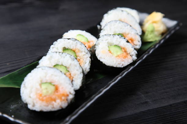 istock salmon with cucumber sushi roll 1141444360