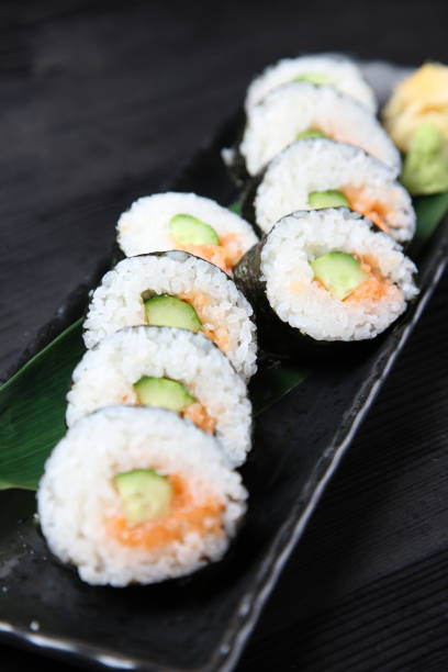 istock salmon with cucumber sushi roll 1141445261