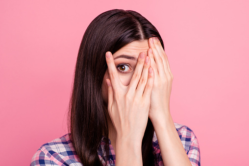 Close-up portrait of her she nice-looking attractive charming lovely confused worried puzzled straight-haired lady closing face palms isolated over pink pastel background.