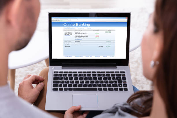 istock Couple Doing Online Banking On Laptop 1141447252