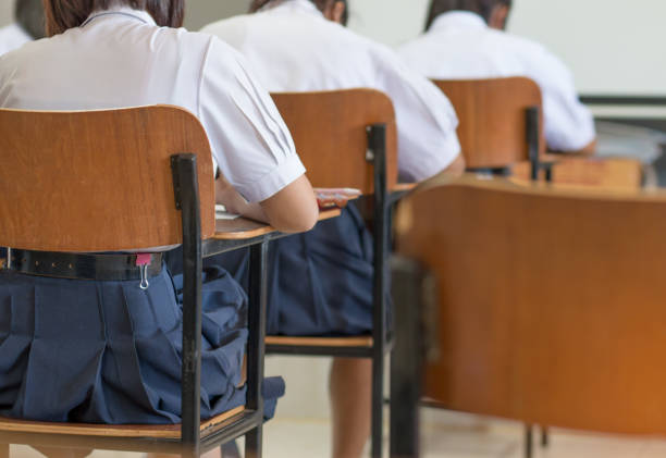 istock Asian students reading and writing a test in exercise, exam in classroom : education concept 1141447260