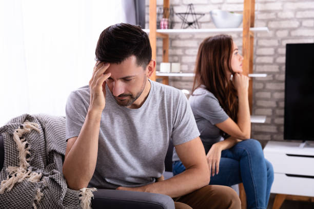 istock Depressed Couple Sitting On Sofa 1141447285