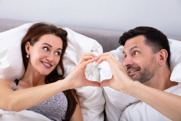 istock Happy Couple Making Heart Shape 1141448055