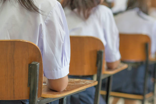 istock Asian students reading and writing a test in exercise, exam in classroom : education concept 1141449465
