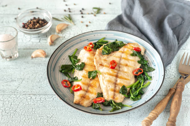 istock Grilled sea bream fish fillet with spinach 1141450802