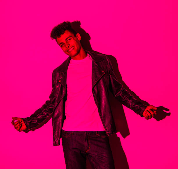 istock Handsome man in colorful lighting 1141453495