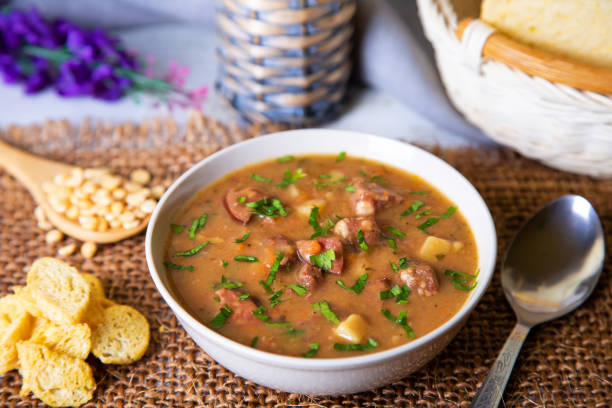 istock Pea soup with meat, smoked sausages and crackers. 1141454912