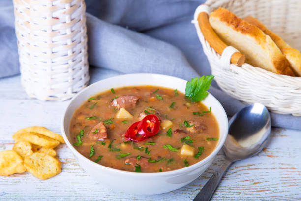 istock Pea soup with meat, smoked sausages and crackers. 1141455081