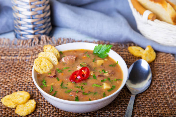 istock Pea soup with meat, smoked sausages and crackers. 1141455132