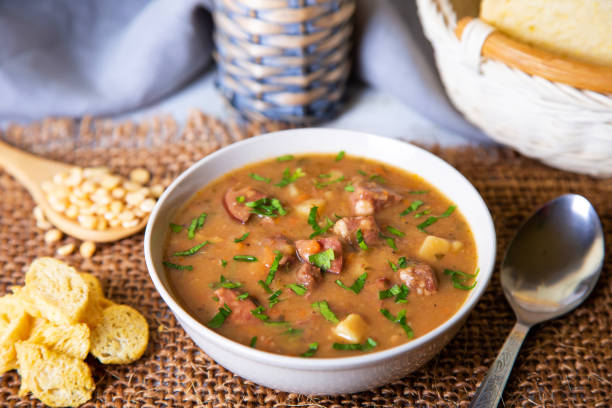 istock Pea soup with meat, smoked sausages and crackers. 1141455174