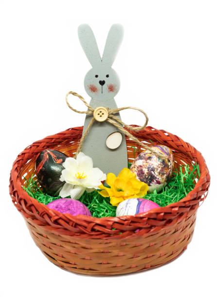 istock Easter decoration with bunnies, eggs, flowers in a basket 1141455772