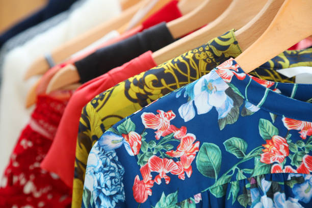 istock Multi-colored clothes on hangers on garment rack. 1141456632