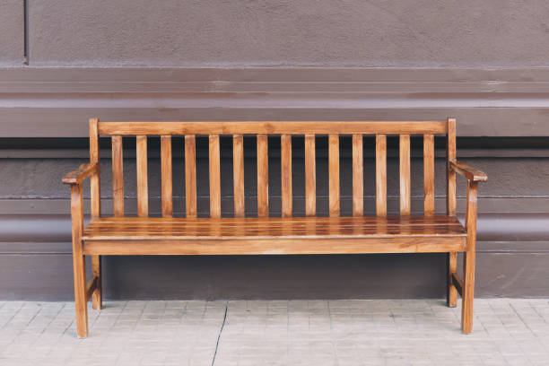 istock Empty old wooden chair and wall background 1141458352
