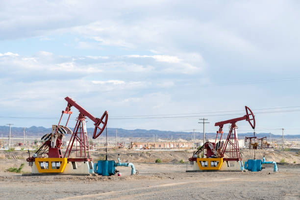 istock Oil pumping ram in the sky background 1141458489