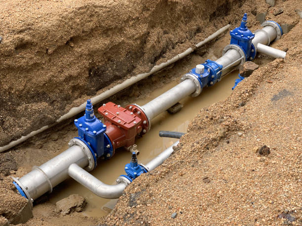 new water pipe in the ground image of new water pipe in the ground underground pipeline stock pictures, royalty-free photos & images