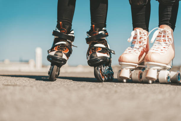 legs of two  girls on roller skates on Tempelhofer Feld in Berlin