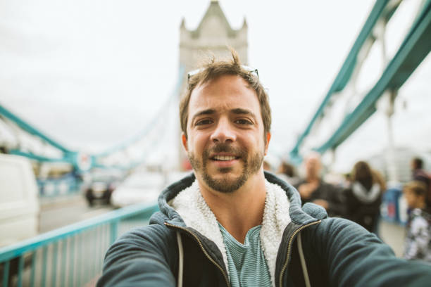 istock Tourist taking selfie on bridge in London 1141460448