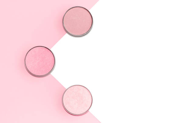 istock Pink, beige and ivory blushes, eyeshadows or highlighters on pink and white background. Flat lay. 1141462007