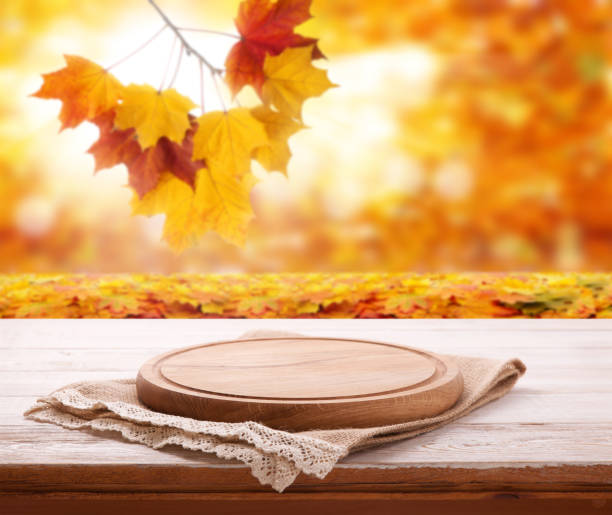 istock Pizza board with tableclothe on wooden desk. Autumn background. Top view mock up. Selective focus. 1141462439