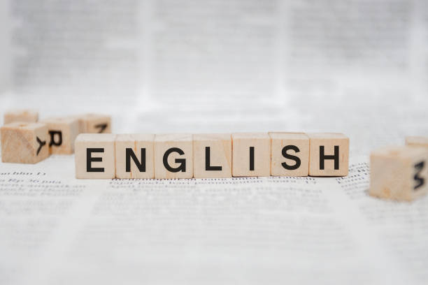 istock ENGLISH Word Written In Wooden Cube 1141462460