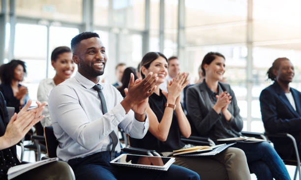 And the good news is, there’s more good news Shot of a group of businesspeople clapping during a conference clapping photos stock pictures, royalty-free photos & images