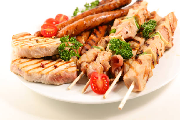 istock assorted barbecue meat with sausage, pork chop and beef skewer 1141463548