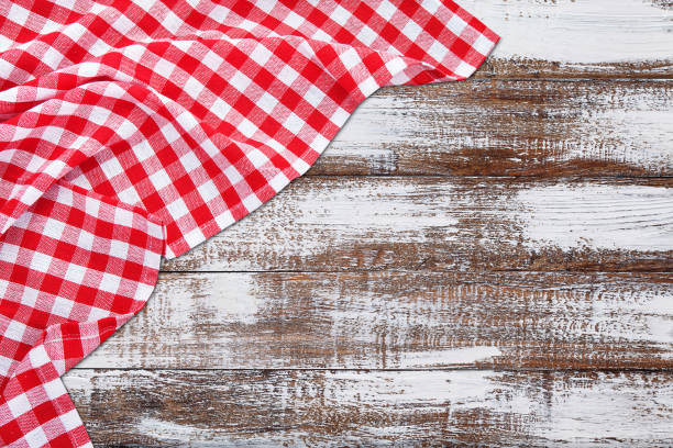 istock Vintage wooden table with red checkered tablecloth. Top view mockup. 1141464006