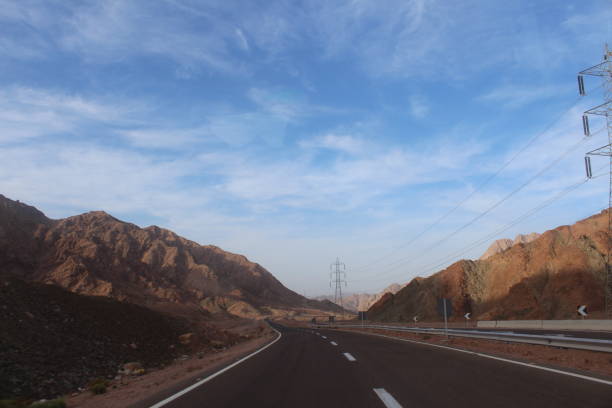 istock Asphalt road in the Egyptian desert. 1141465953
