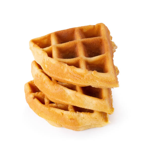 istock Freshly baked waffles isolated over white background. 1141467926