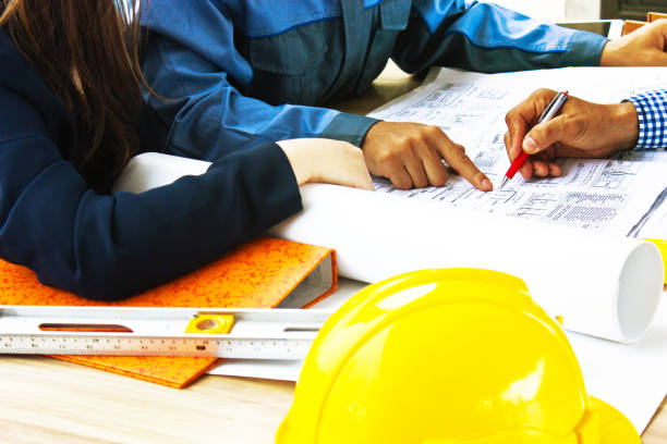 istock Architect and Engineer Team Discussing the Blueprint on the Table 1141468005