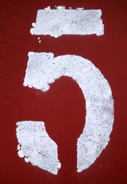 istock Number 5 in stencil on metal wall. 1141471613