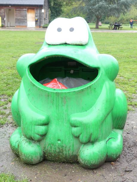 istock Green frog design garbage box in parkland 1141473659