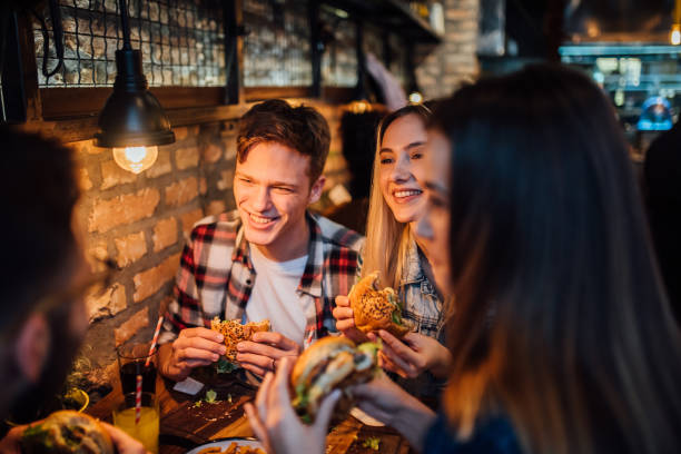 istock Friends sharing a meal 1141474136