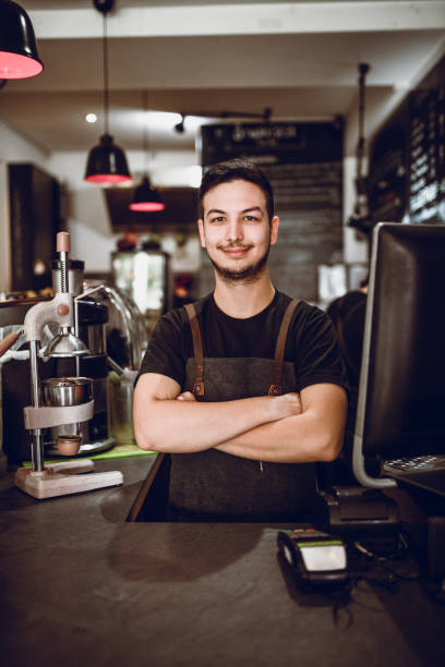 istock Smiling Waiter Waiting For Payment 1141474710