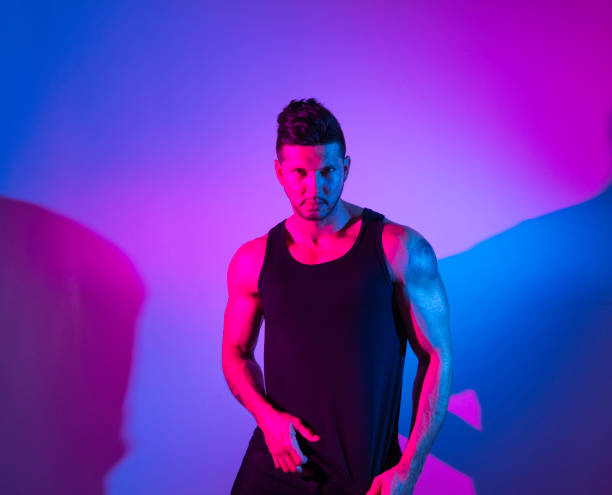 istock Handsome latino man in front of colorful wall 1141475334