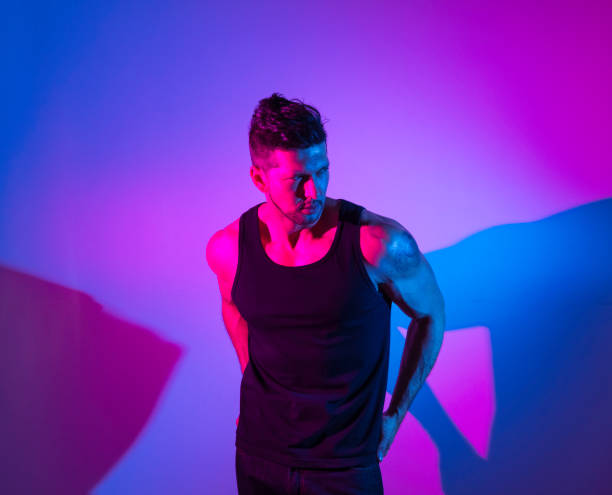 istock Handsome latino man in front of colorful wall 1141475568