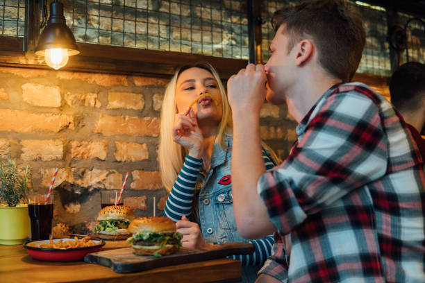 istock Couple playing with food 1141476100