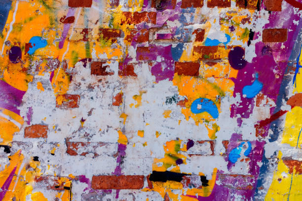 istock Old wall with many different paint remains multicolored 1141479465
