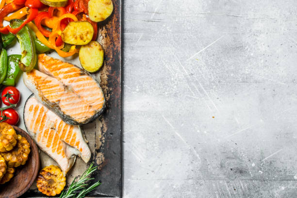 istock Grilled salmon steaks with vegetables. 1141482305