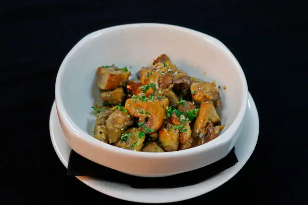 Photo of saute button mushrooms in a bowl