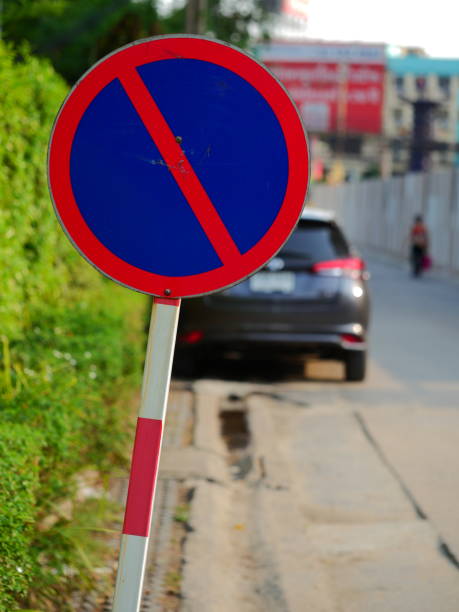 istock Stop sign among the trees and leaves 1141484166