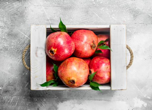istock Fresh pomegranate in the box. 1141486327