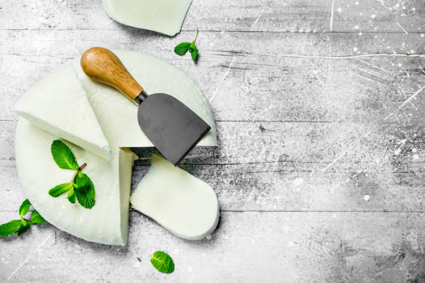 istock Soft sheep cheese with fresh mint leaves. 1141486597