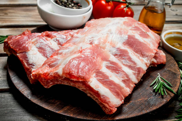 istock Raw ribs with spices and herbs . 1141486939